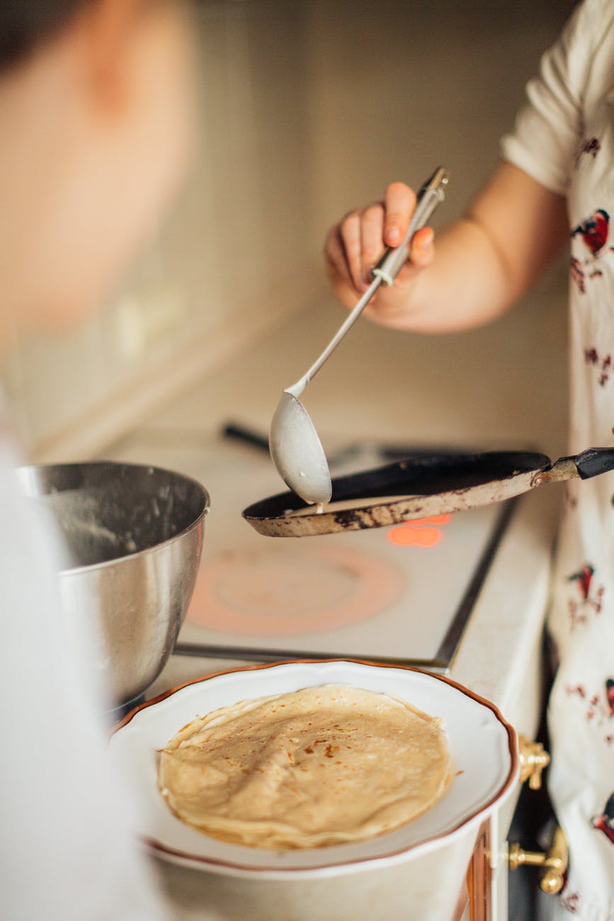 mother and child preparing crepes